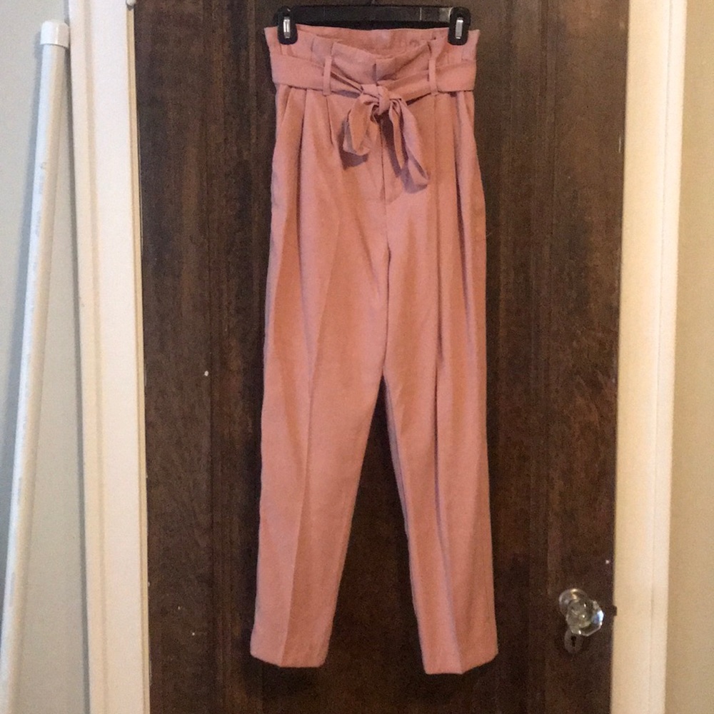 High-waisted paper bag pants.